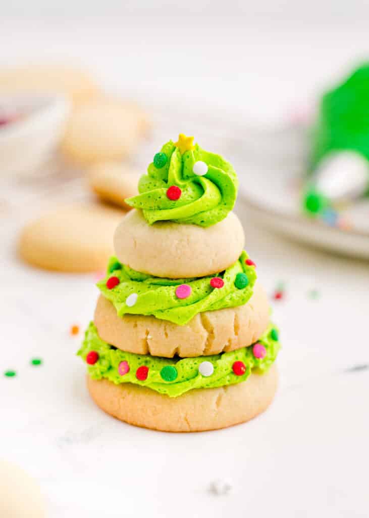 Christmas Tree Stacked Cookie with neon green frosting and sprinkles.