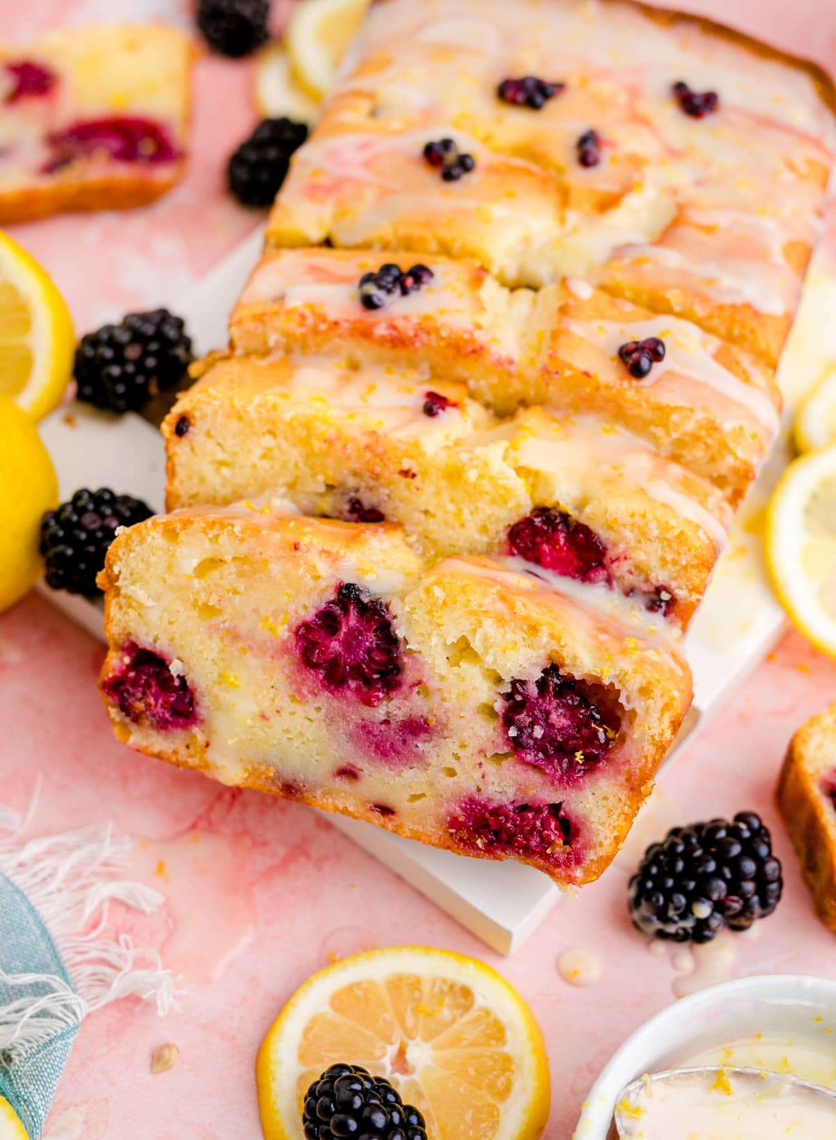 mouth-watering slices of lemon blackberry bread showing the inside of the loaf.