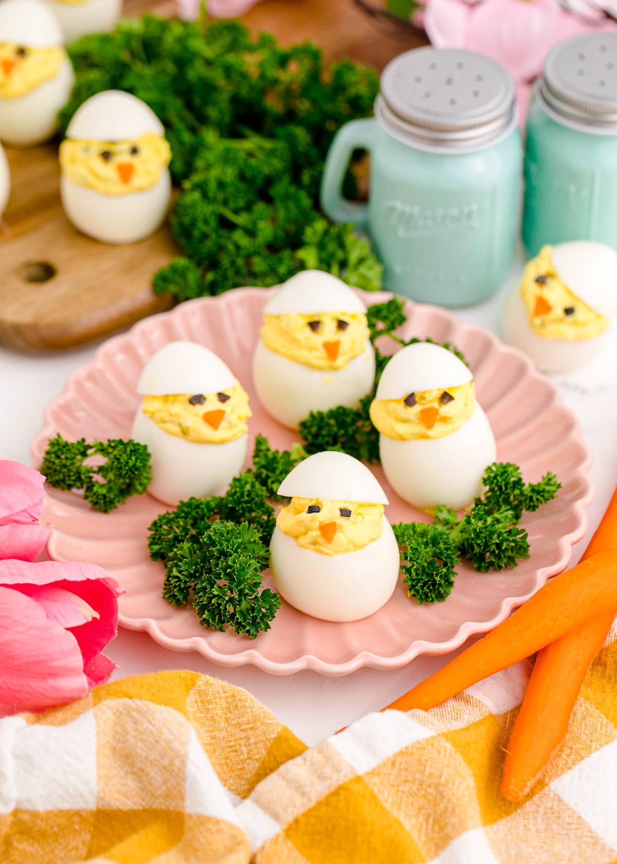 Dozen Easter egg chicks on a serving tray with parsley.