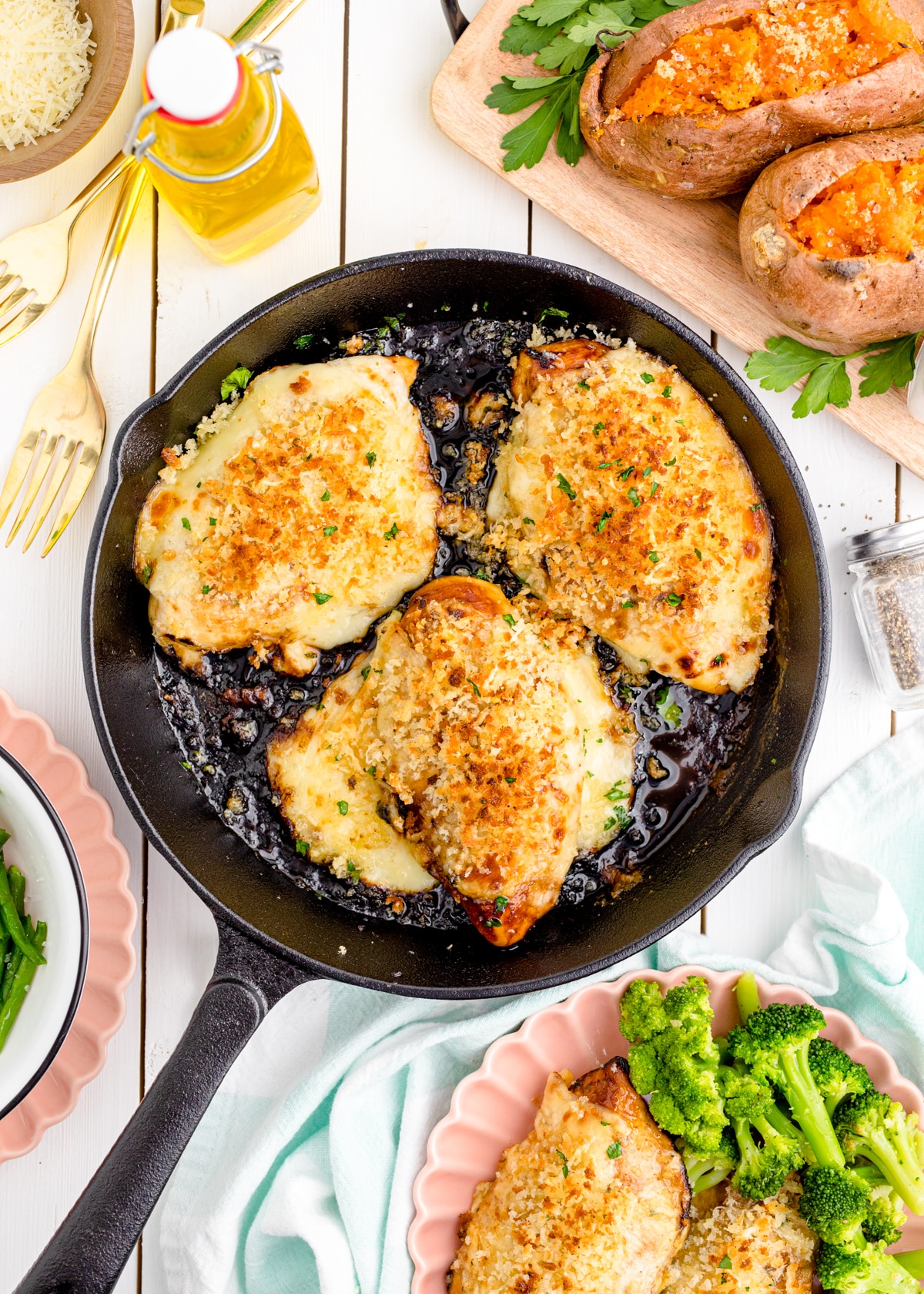 Parmesan crusted chicken in a cast iron skillet.