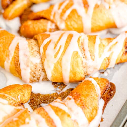 Cinnamon crescent rolls drizzled with a powdered sugar icing.