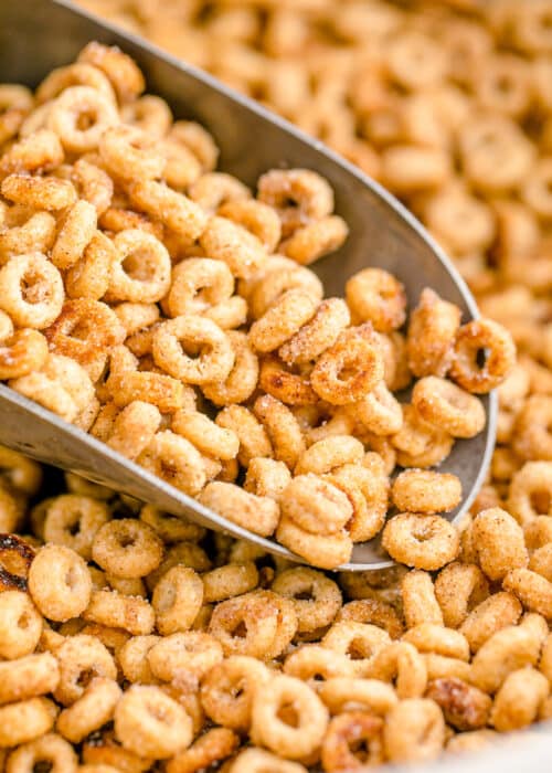 Hot buttered Cheerios that look like a little mini donuts in a metal scoop.