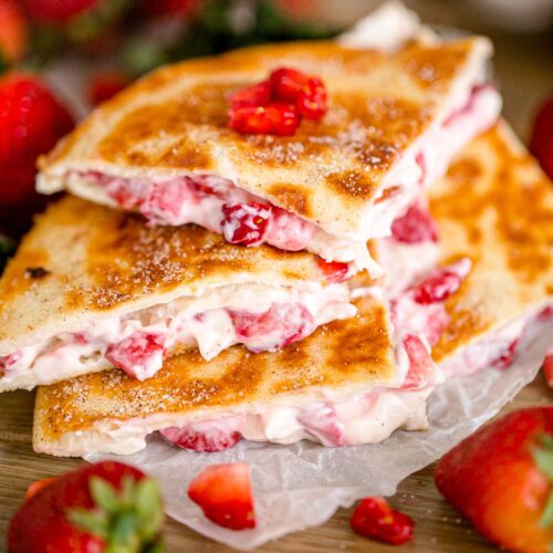 Strawberry cheesecake quesadillas stacked on top of each other.