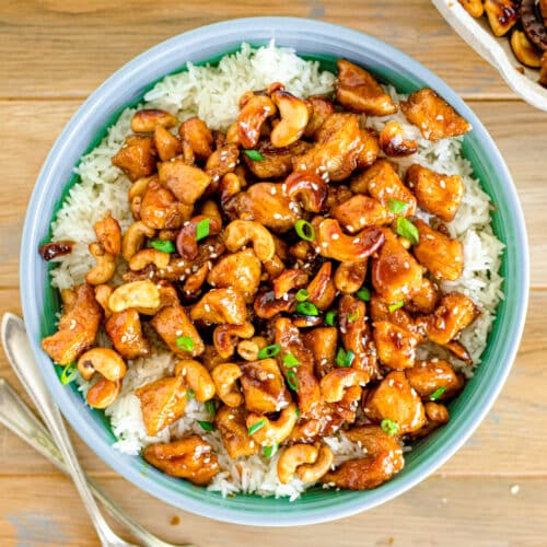 Stir fried cashew chicken served over a bed of rice.